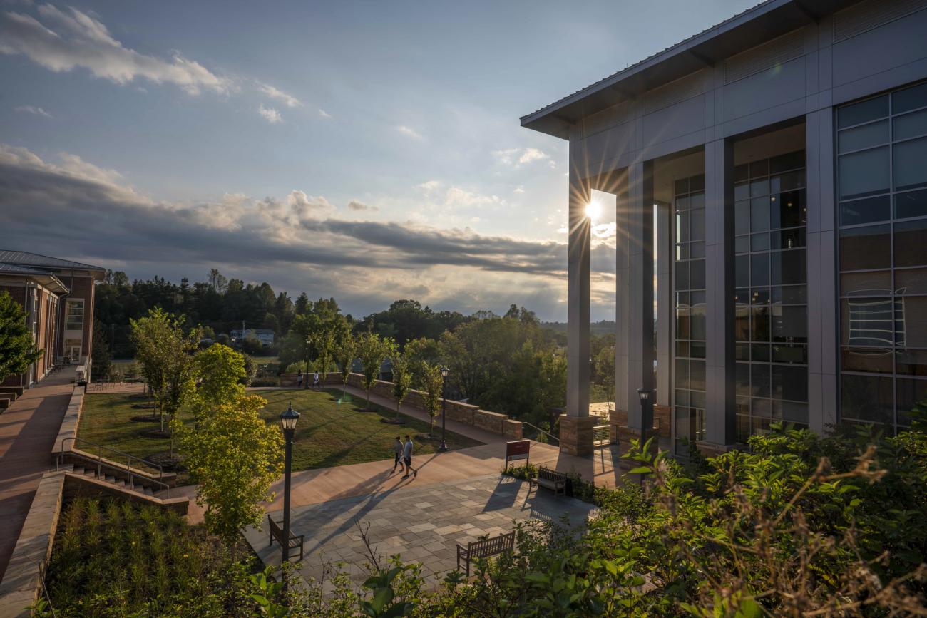 The sun sets behind the Library at the College at Wise.